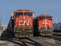 CN 5632 with CN 2276 lead train 371 through Sarnia as Train 385 with CN 2860 puts its train together in the yard.