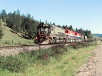 Time table scheduled train No 23 approaching Macalister siding on it's journey to Prince George BC. This is symbol freight "VP" ( Vancouver-Peace) and was the BC Rail hot shot priority train carrying lot of TOFC, perishable, construction materials and other high value traffic. Quite a selection of motive power this day including a RCC car.