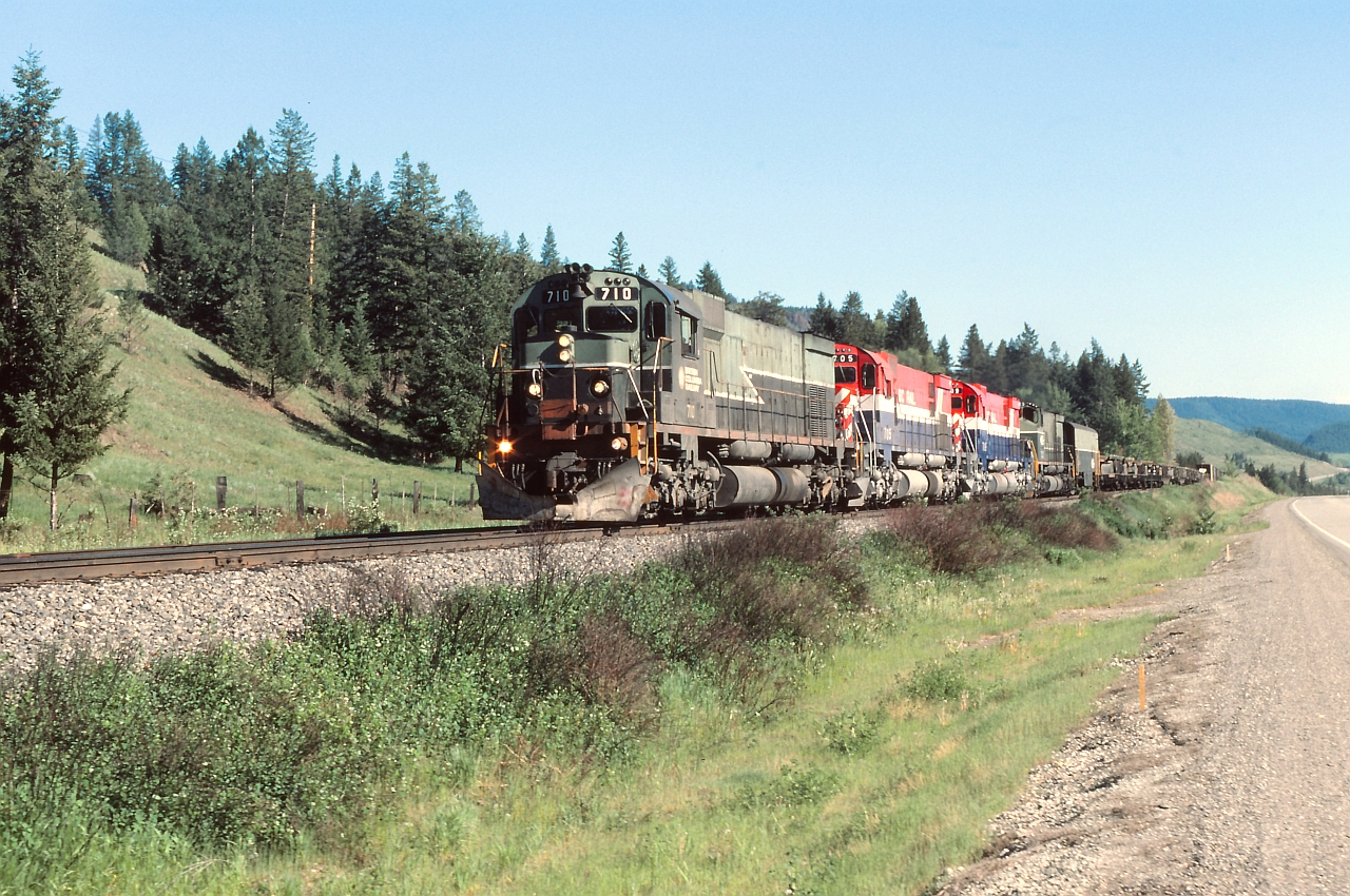 Time table scheduled train No 23 approaching Macalister siding on it's journey to Prince George BC. This is symbol freight "VP" ( Vancouver-Peace) and was the BC Rail hot shot priority train carrying lot of TOFC, perishable, construction materials and other high value traffic. Quite a selection of motive power this day including a RCC car.