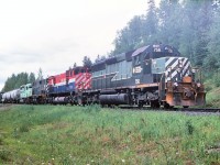 A dull June afternoon and a photo op at Greening. Lets see we have a GMDL leading, couple models from MLW and a EMD trailing. This is train #34 from Prince George to Williams Lake. Our symbol is "CV" Cariboo-Vancouver and we have loads and empties that originate in Prince George for various destinations south.