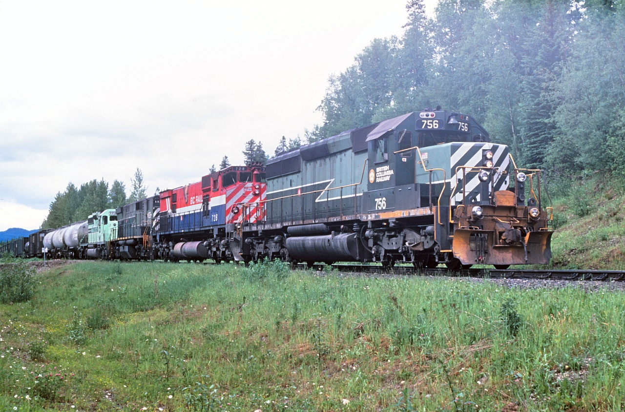 A dull June afternoon and a photo op at Greening. Lets see we have a GMDL leading, couple models from MLW and a EMD trailing. This is train #34 from Prince George to Williams Lake. Our symbol is "CV" Cariboo-Vancouver and we have loads and empties that originate in Prince George for various destinations south.