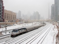 <b>Hot Child In The City, Runnin' Wild And Lookin' Pretty</b> With ice pellets blasting my face on this cold April morning, VIA 97 crawls through on the Union Station Rail Corridor with a foreign visitor, AMTK 514, a P32-8BWH. Very rare do these units show up in Maple Leaf service, but a nice break from the monotonous parade of P42's. 