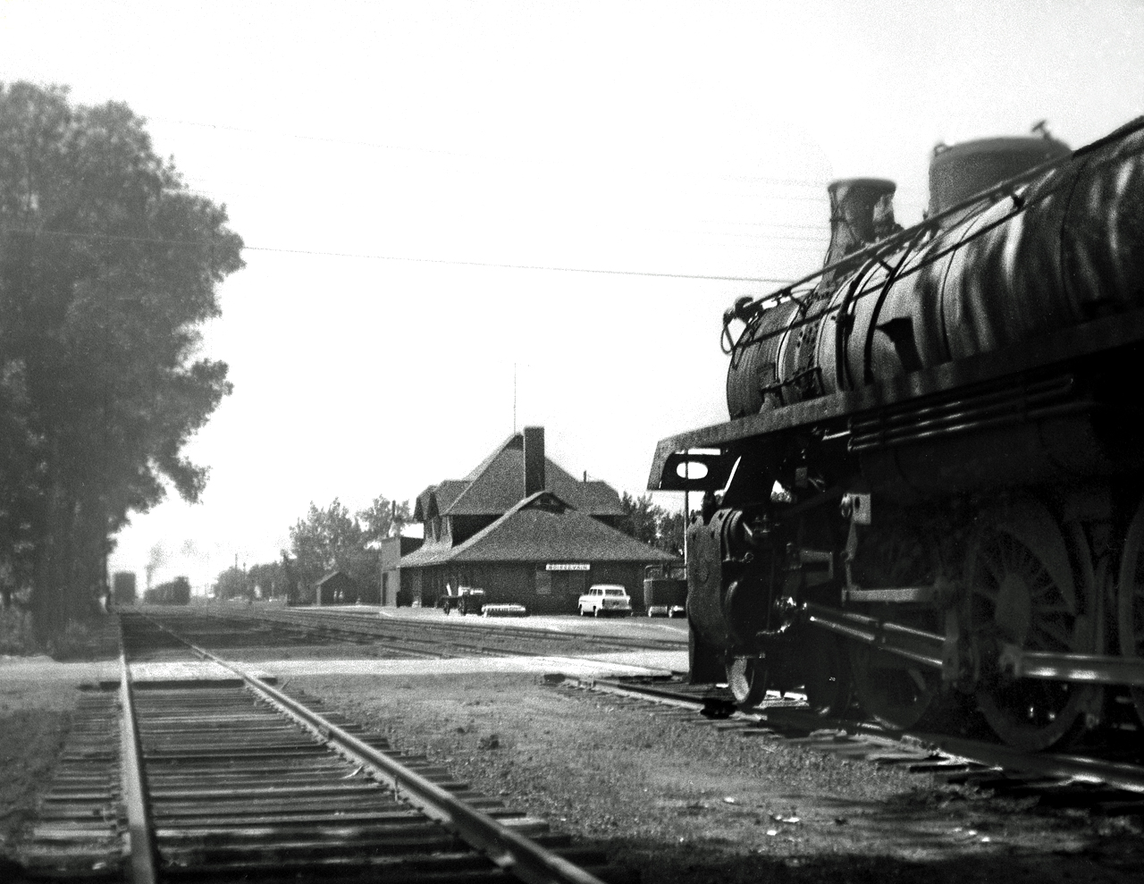 G5 4-6-2 1212 on the Souris to Lyleton mixed train sits in siding waiting to follow the La Riviere to Napinka wayfreight with sister 1213 who just departing town