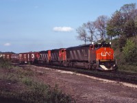 With most of the train still rolling downhill into Bayview and through 15 mph switches in the plant, the engineer of this westbound will have to carefully manage his slack and power as he throttles out for the 10 mile climb to Copetown. Power on this lovely June evening is HR616 2104, and GP40-2LWs 9435 and 9576.