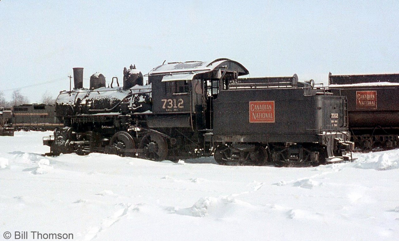 CN Stratford shop engine 7312 (an 0-6-0 built by Baldwin in 1908 for the Grand Trunk Railway) is pictured just removed from service in March 1960. 7312 would soon be sold to the Strasburg Railroad in Pennsylvania for tourist service, where it acquired the number 31. It is still in service today, restored to its previous CN number 7312.