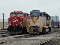 Delaware & Hudson GP38-2 #7304 poses with AC4400 9711 on a soggy day at the west end of Agincourt Diesel.
