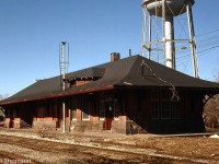 Canadian Pacific's Brampton Station is pictured in a state of disrepair, sitting on its original station site north of Queen Street on March 16th 1981.
<br><br>
Originally built in 1902, the last passenger train stopped here on November 30th 1970. The station was then closed and used as storage by CP, who applied to demolish it in 1977. The Brampton Heritage Board helped save it, and it was moved off-site in December 1981 to Hutton Nurseries (off Creditview Road). The property was sold in 1988 to build Lionhead Golf Course, and the station again languished in disrepair until property owner Kaniff Ltd planned to demolish the dilapidated heritage building the late 90's.
<br><br>
The city and heritage board then stepped in again, and the old station was dismantled by hand and moved to a resident's property in Norval where its pieces were stored. There were plans discussed in 2003 for it to become part of the new GO Transit Mount Pleasant station, but they ultimately fell through. The old station was eventually relocated and rebuilt in Mount Pleasant Village as part of the community centre in 2010, a stone's throw from the GO station.
