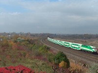 A west bound GO train passes between Hopkins street and South Blair. Two very good locations once in time for rail photography. Almost 5 years since this photo at near noon on a beautiful fall day. Now just concrete buildings and a dust bowl for scenery.