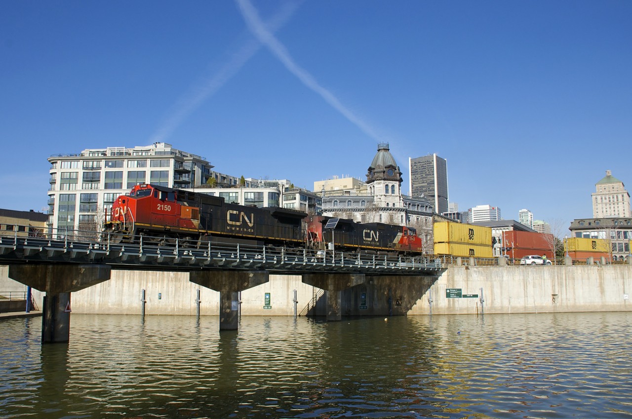 CN 2150 & CN 2643 lead CN 149 over the Lachine Canal as they leave the Port of Montreal with a 9800 foot-long train.