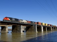CN 149 has three EMD units (ex-Oakway SD60 CN 5443, ex-BNSF SD75M PRLX 201 and SD70M-2 CN 8924) as it leaves the island of Montreal on a sunny morning.