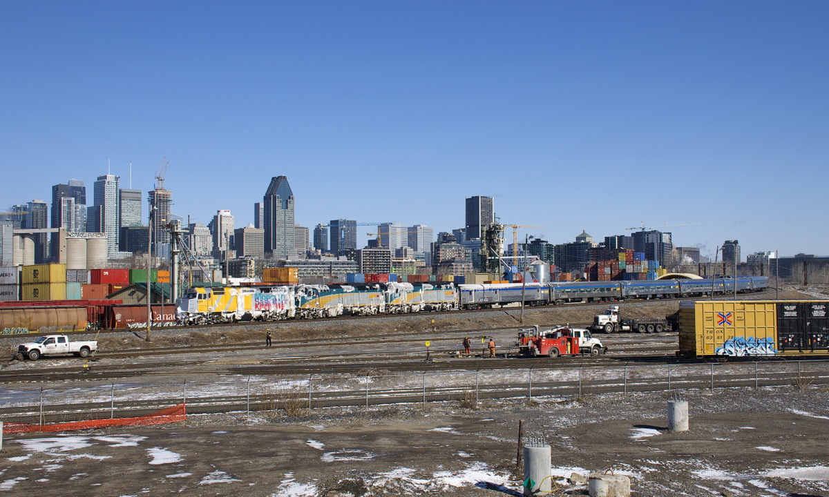 The power on VIA 15 (wrapped unit VIA 6402 along with VIA 6426 & VIA 6445) is covered in snow as it backs up towards Central Station in Montreal, its voyage from Halifax nearly over. While Montreal only got rain, eastern Quebec and New Brunswick got quite a bit of snow yesterday, explaining the snowy power. This past winter one Budd trainset had been alternating with a Renaissance trainset on VIA 14/15; today's 15 is the last scheduled to have a Budd trainset.