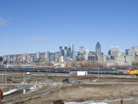 Wrapped for VIA Rail's 40th anniversary, VIA 914 pushes seven Budd cars as VIA 65 backs up towards Central Station in Montreal.