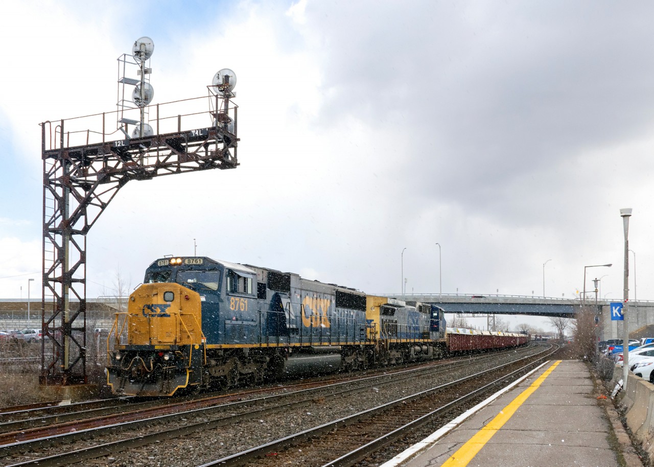 CSX has been retiring a number of SD60's recently, so it was a nice surprise to see ex-Conrail SD60M CSXT 8761 leading CN 327. It's passing under a signal gantry at Dorval with CSXT 67 trailing as a bit of snow falls.