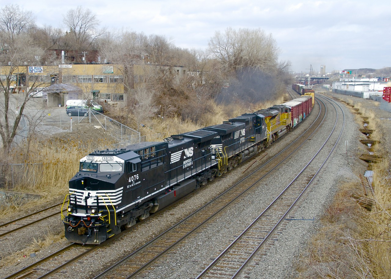 Released from the Juniata shops just two months ago (after being rebuilt into an AC44C6M from C40-9 NS 8886), NS 4076 is the leader on a 48-car CN 529. Trailing is NS 9180 & UP 8935.