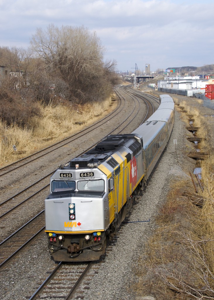 VIA 6436 is wrapped for VIA Rail's 40th anniversary as it heads west through Montreal West with VIA 67.