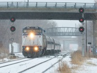 To go along with Steve's shot, <a href="http://www.railpictures.ca/?attachment_id=33016"> http://www.railpictures.ca/?attachment_id=33016 </a> , Amtrak 64/VIA 97 enters the Grimsby Sub in this weekend's sleet and freezing rain mess on the hot track

