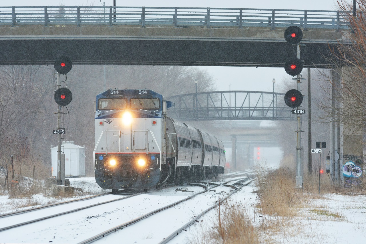 To go along with Steve's shot,  http://www.railpictures.ca/?attachment_id=33016  , Amtrak 64/VIA 97 enters the Grimsby Sub in this weekend's sleet and freezing rain mess on the hot track