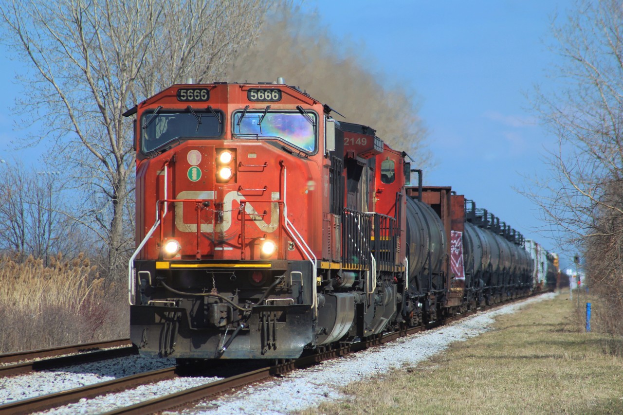 CN A439, making a rare daylight run, is hurrying into the city as Via 73 races directly behind him. Lately CN's trains to Windsor have begun to increase heavily in freight, with today's 439 being 102 cars long. These long trains have forced CN to send down much more interesting power, as last week's 438 had CN's 15th anniversary unit, 2124.