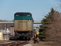<b>Divided by the Canadian and American border, locomotives of each country's national passenger railroads sit on their respective sides of the bridge.</b>
<br><br>
Amtrak 121 was uncooperative and refused to pull the Maple Leaf back to the states on this morning. After hours of trying to resolve the situation, Via 6419 was finally placed on to lead the Maple Leaf to Niagara Falls. 
<br><br>
6419 has done its job, and one of Via's finest begins to throw the switch so 6419 can back into the siding. On the other side of the Whirlpool Rapids bridge on the American side is Amtrak 110. It will back across the bridge as soon as 6419 backs into the siding and the switch is realigned. It will take over the duties of Via 6419 to Albany-Rensselaer. 121 was coupled to the Maple Leaf alone at this point, still capable of providing HEP to the coaches, but unable to move under its own power. These type of movements are quite rare, but it is something Via and Amtrak have performed before. The majority of Amtrak's P42DC's are one to two years overdue for another rebuild or retirement, so perhaps this will become more frequent since it appears since neither seem imminent under Amtrak's budget woes.
<br><br>
Amtrak used two crews for this move, with one already on the Canadian side and the other in Amtrak 110. Since ownership of the Whirlpool's upper deck was transferred to Amtrak, the Via unit is technically in Amtrak territory, as the sign on the left adjacent to the bridge indicates. The Canadian flag is flying at half mast for the 16 people that lost their lives in the Humboldt Broncos bus tragedy, likely with each day dedicated to each life lost.
<br><br>
This move occurred only one half hour before the CBSA showed up for the arrival of Via 98. Known to be very territorial and precautious at the station, this shot most certainly would not have been possible if this switching move was done after they arrived. Since Via 97 arrived at Niagara Falls so late, it had to wait for Amtrak 63 (to become Via 98) to depart Niagara Falls, NY. Amtrak 64 (formerly Via 97) left Niagara Falls after the CBSA arrived, anticipating boarding Amtrak 63. The CBSA was very clearly confused, seeing the power was at the other end. They wandered about talking to the crews, and even hopped on the train at one point, probably under the assumption the passengers were Canadian arrivals on 63. Thankfully, the poor passengers, already seven hours late, did not have to deal with confused CBSA guards. The American CBP still await them however.