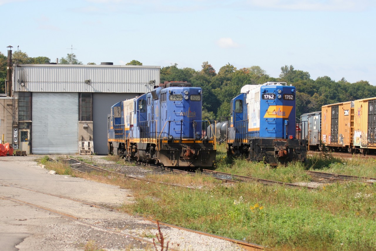 Former RaiLink power is seen at the Southern Ontario Railway (SOR) locomotive facility at SOR’s Stuart Street yard in Hamilton, Ontario on September 28, 2008. The still lettered RaiLink unit’s include GP9 4205, GP7 1756 and GP10 1752. GP7 1756 had previously suffered a bent frame after an accident while switching and was scrapped in Hamilton during October 2008.