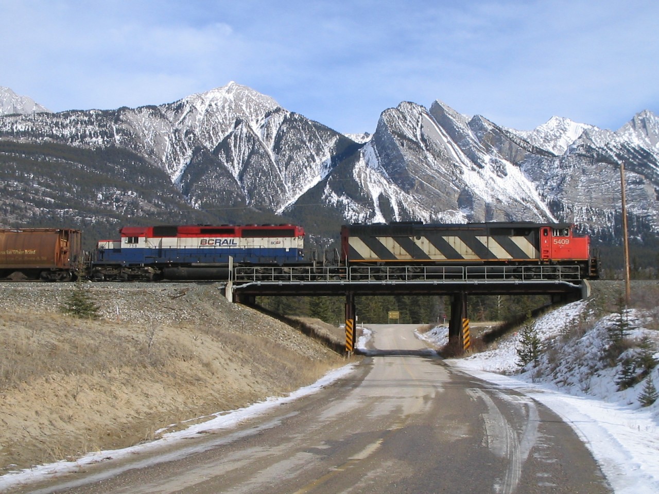 My first attempt to post a picture on this awesome board. :)

This westbound grain train was stopped on the siding near Henry House with no one onboard, not sure why. Jasper's yard was empty. Maybe mechanical issue, but a crew came in late evening and just left with it, so I don't know.