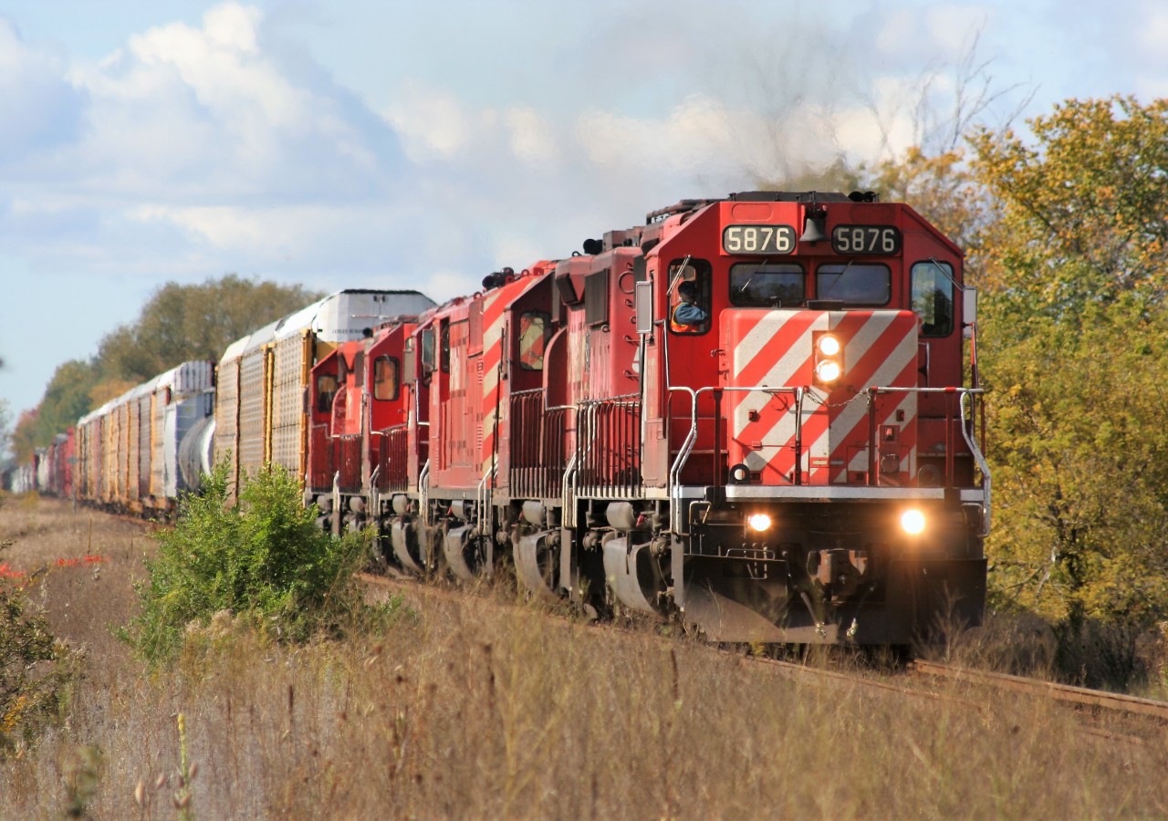 An eastbound Canadian Pacific train is seen rolling through Thamesford, Ontario on the railway’s Galt Subdivision with SD40-2 5876, SD40-2 5788, SD40-2F 9012 and SD40-2’s 5990, 5867 and 5763. The train had just met a westbound at Nissouri and was proceeding east to lift cars at Galt. Looking back I’m glad we gave chase…..