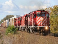 An eastbound Canadian Pacific train is seen rolling through Thamesford, Ontario on the railway’s Galt Subdivision with SD40-2 5876, SD40-2 5788, SD40-2F 9012 and SD40-2’s 5990, 5867 and 5763. The train had just met a westbound at Nissouri and was proceeding east to lift cars at Galt. Looking back I’m glad we gave chase…..