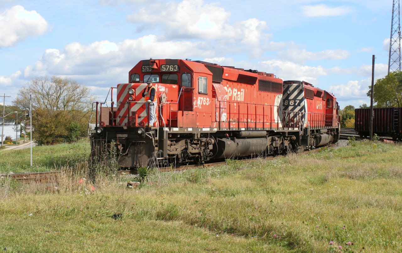 An eastbound Canadian Pacific train is viewed backing through the yard at Galt, Ontario as it makes its way towards the Waterloo Subdivision to lift several loads of new Toyota traffic. The consist includes; SD40-2 5876, SD40-2 5788, SD40-2F 9012 and SD40-2’s 5990, 5867 and 5763.