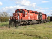 An eastbound Canadian Pacific train is viewed backing through the yard at Galt, Ontario as it makes its way towards the Waterloo Subdivision to lift several loads of new Toyota traffic. The consist includes; SD40-2 5876, SD40-2 5788, SD40-2F 9012 and SD40-2’s 5990, 5867 and 5763.
