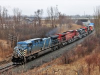 Its not often you find a quartet of power with four different lines. Here CEFX 1036 leads CP 9681, BDRV 1888 and CN 3026 out from under Highway 6 bridge approaching Newman Road on the Hamilton sub. The BDRV 1888 is on its way to the Black River and Western Railway in New Jersey. As is normally the case, the best trains come in the rain and with a light fog.