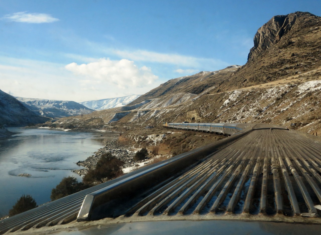 THOMPSON RIVER TRACKS. VIA Rail's train No. 1, the Canadian, has departed Kamloops North and is headed west to its next stop at Ashcroft, British Columbia. As seen from the Prestige Dome'Glacier Park', the scenery is nothing short of spectacular as the train follows the contours of the Canadian National tracks along the beautiful Thompson River while crossing over it several times. On the opposite side and quite a treat for the photographer and his wife, were the Canadian Pacific tracks on which many of that company's trains were encountered running right across from VIA's flagship on this beautiful afternoon.