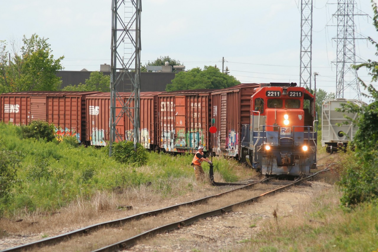 Goderich-Exeter Railway train 582 with RLK GP35m 2211 (at that time still lettered for RailAmerica) is seen in Guelph, Ontario with boxcars it’s just lifted at the Smurfit-MBI facility.