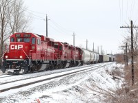 Yes it is mid April, and this April fools joke has gone on long enough :) The freezing rain has disappeared as the day progressed but much of the snow accumulated over the weekend remains. This location up to a number of year ago was known as Kilean, but that name disappeared when CP severed the siding at the east end. Here we see train T69 nearing the end of the former siding as it prepares to work a local scrap yard hidden by the train, which is the main reason the track the train is sitting on survives today. 