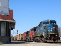 Its no secret that General Electric's Dash-8 locomotives days may be numbered. Many Class 1 railroads have already drastically thinned out their fleets as newer environmentally friendly units come on line. The Dash-8 line though was a turning point for GE, and innovations created with the model gradually helped push the builder into top spot. Better fuel consumption then EMD's SD40's and SD60's would help lead to the models longevity, while many similar six axle EMD products on many railways rosters were retired. Today CN rosters more of the Dash-8 variations then any other railroad in North America, and with new locomotives on the way by years end now is the time to capture as many Dash-8s as possible. Here CN "Blue devil" Dash-8 #2460 rolls under clear blue skies at Georgetown as it runs off its last leg of its trip to Toronto yard.