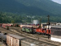 Having yarded its train a pair of BN geeps off the local from Kettle Falls Wash. head for the fuel racks on the other side of the diesel shops. Pre Free Trade international runs were required to purchase Canadian fuel equivalent to amount used in Canada