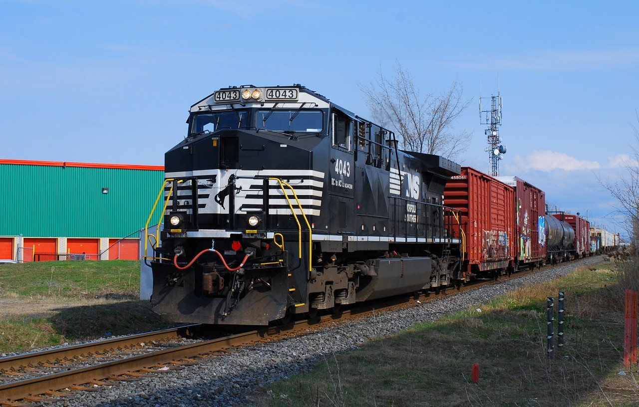 Ns-4043 AC-44C6M pulling a small convoy coming from US on Rouses Point Sub.on CN-route 529 going to Taschereau yard