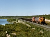 Iron ore loads out of Labrador City pass DeMille Lake on its way to Emeril Junction and connection with main line to Sept Iles