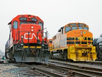 CN 4713 and RLHH 3049 sit side by side at Brantford Yard, once sisters under the same company umbrella. The old girl was sold off years ago to another shortline, only for her to come back on Canadian rails as RLHH3049.