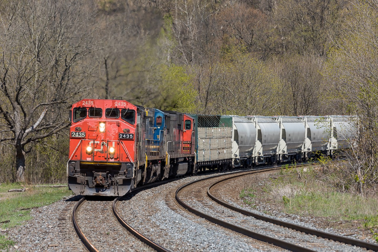 CN train no. 435 sweeps through the curves at Dundas, Ontario with an assortment of power that has become increasingly common as of late.