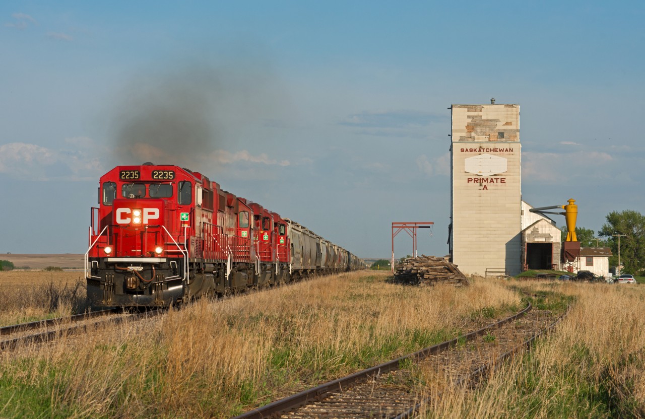 A quartet of four axle units lug 116 grain loads up-grade through Primate Saskatchewan on CP's Macklin Subdivision.