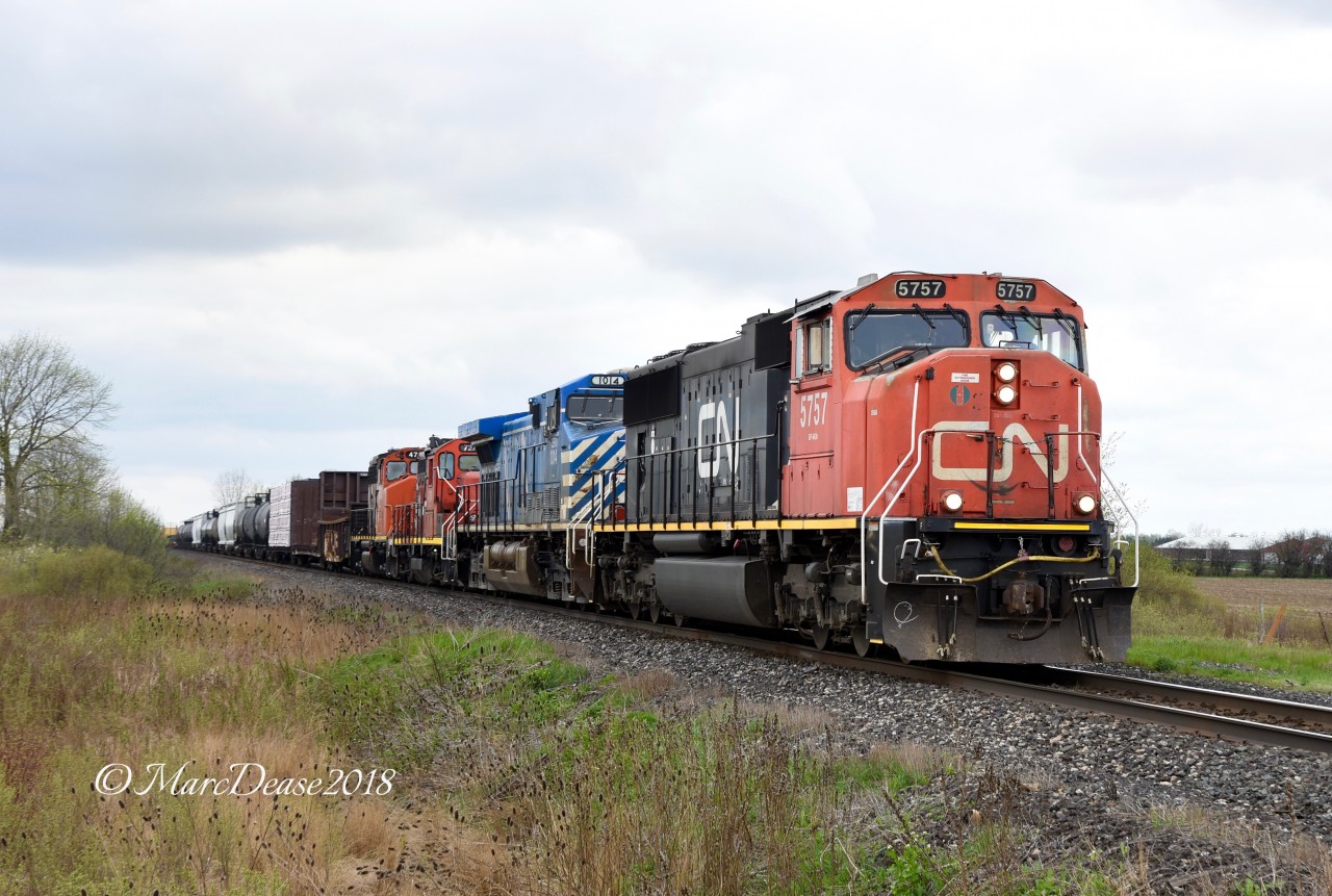 CN 5757 with CFEX 1014 and a couple of off line units trail Train 509 out of Sarnia heading back to London, ON.