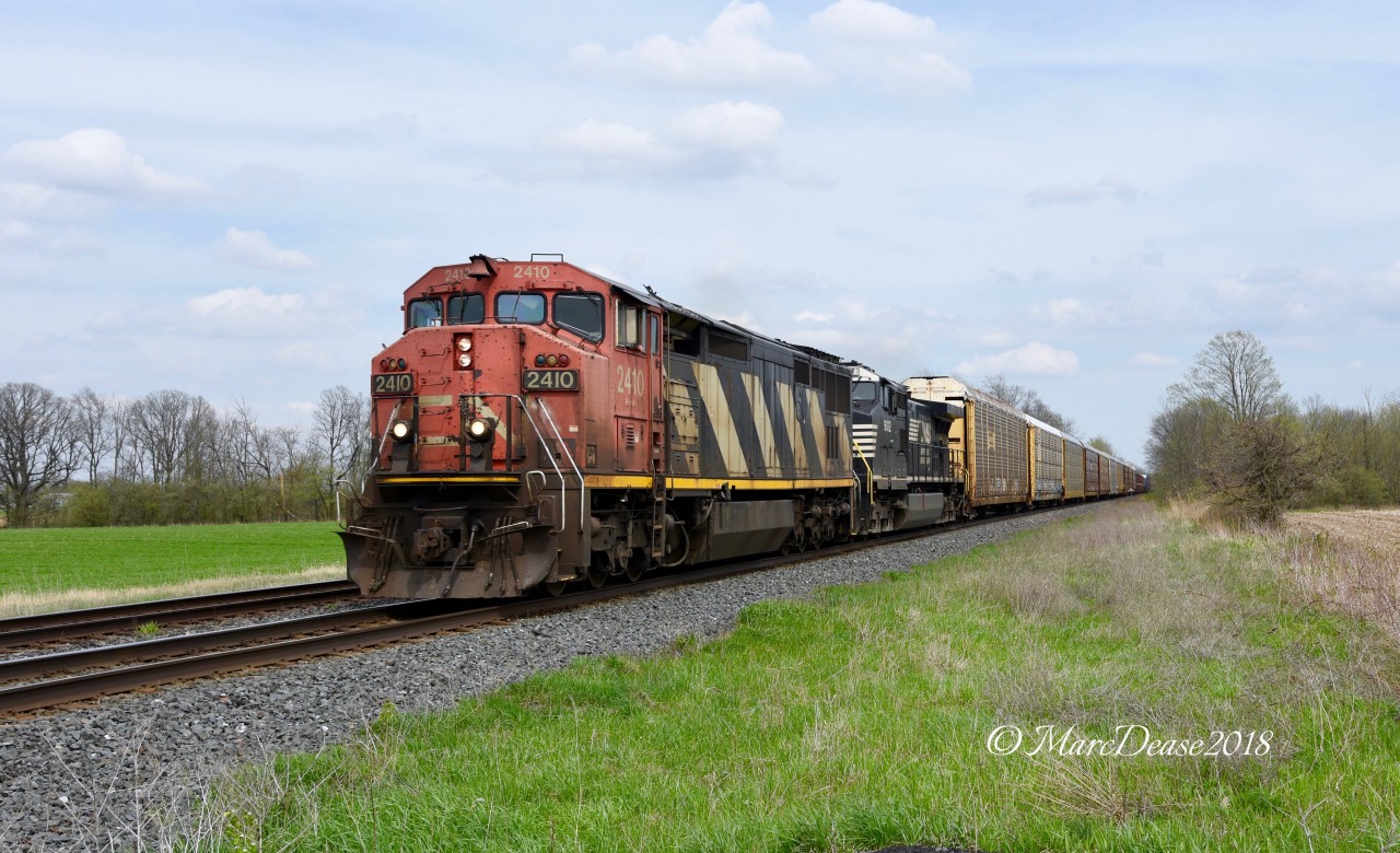 I'd heard this train had a nice lash up so I went out hunting this afternoon. Train 397 rolls past Stewardson Sideroad with CN 2410 and NS 9012.