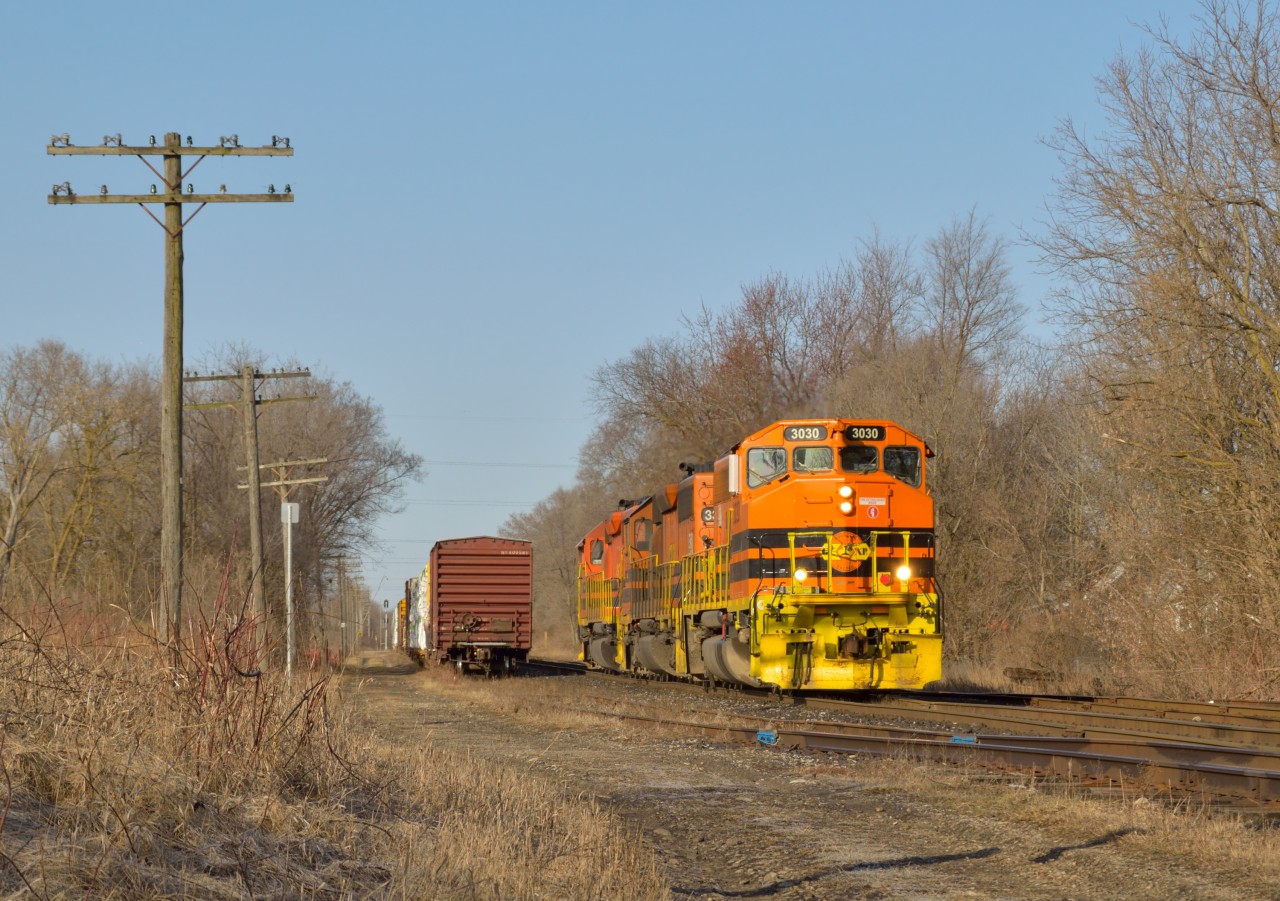One thing I'll miss about the orange come November is the pop of colour it gives in the morning/late evening sun.  Light power for the trip to Mac Yard, 432 scoots through Guelph on a sunny Easter Monday.  The GP40-2LW, finest looking of the GEXR power, leads the way into the rising sun.