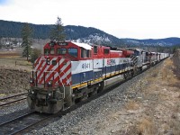 Train 571 in the siding at Mackin on the BC Rail Prince George sub. Eventually train 570 arrived with BCOL 765 leading, unfortunately a snow flurry arrived and hindered lighting for photos. I was able to contact a rail fan friend to alert him of the 765 leading on the southbound train. He and another fellow chased the train on the Squamish sub the next morning. The BC Rail SD-40's were getting scarce let alone leading.