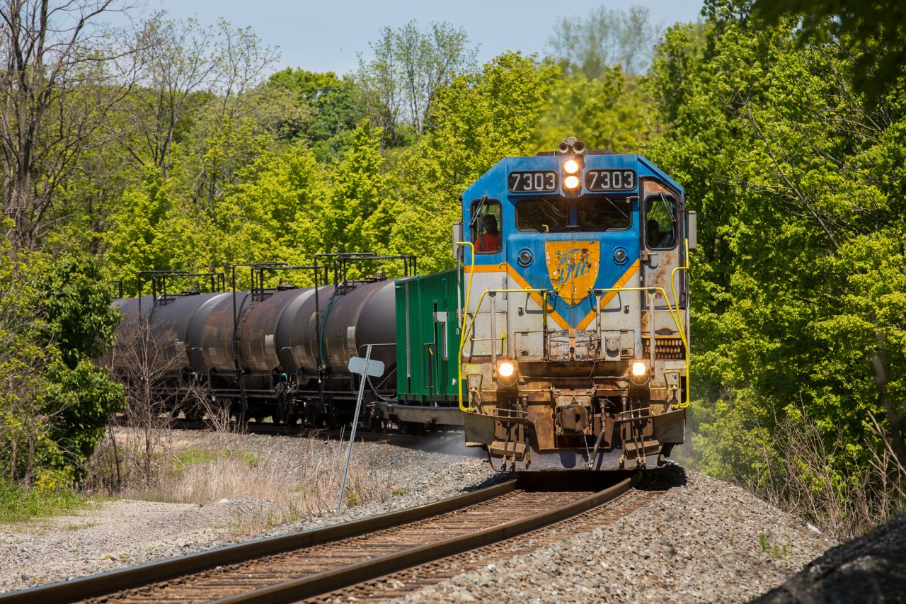 For the second year in a row, Canadian Pacific has tasked one of only two locomotives in original Delaware & Hudson paint to their annual spray train. Here, D&H 7303 negotiates one of the many curves at Waterdown, Ontario as the train descends the Niagara Escarpment on the Hamilton Subdivision.
