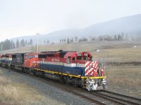  In a snow flurry, train 570 arrives at Mackin with a few more miles left before a crew change at Williams Lake BC. It was an interesting power consist with BCOL 765, CN 5648 and BCOL 758. A few railfans chased this train the next morning on the Squamish sub account the 765 leading. Also note the car loads of logs behind the units, this would be aspen / poplar logs destined for the "oriented strand board" plant in 100 Mile House.