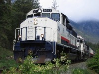 Another quick photo while we were stopped awaiting more track authority. Threatening skies with some rain showers along the shores of Seton Lake. I did not have a brush cutter to knock down the shrubbery and was more concerned about sliding down the bank into the cold lake water. Hard to believe, I was actually being paid to run the train.