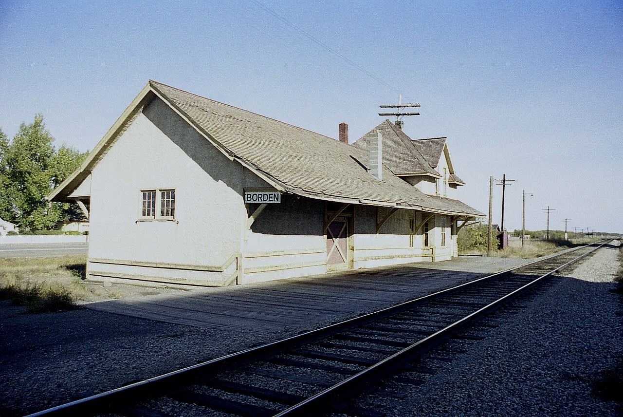 One must imagine how important the railroads must have been to the communities of the west, and visa-versa when looking at this old image of Borden's CN station. Good sized building. And to think this town never did have much of a population. It's tally in 2016 was only 287 people. But,a generous fair sized structure shows how much the community business once revolved around being down by the tracks. I'd guess this relic of the old "CN Prairie North Line" has long been razed, but I have no information and certainly would like some if any of you viewers happen thru this area. Not sure where to locate this building on the map either; we can see it is in the shadow of a grain elevator. But which? And the Yellowhead Highway has been widened since this shot, and no doubt realigned as well. Station constructed 1906.