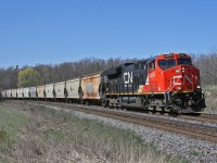 CN B 78131 07, rolls westwards down the Halton Sub with CN 3034 on the point and CN 2968 as the mid train DP unit.  This 209 car unit train of Potash empties is bound for Yarbo, Saskatchewan and originated in Moncton, New Brunswick as B 73111 06.  Originally planned to operate over the more direct route through Northern Ontario, the symbol was changed to 781 at Belleville to allow it to detour south of the Great Lakes due to congestion in Northern Ontario.  