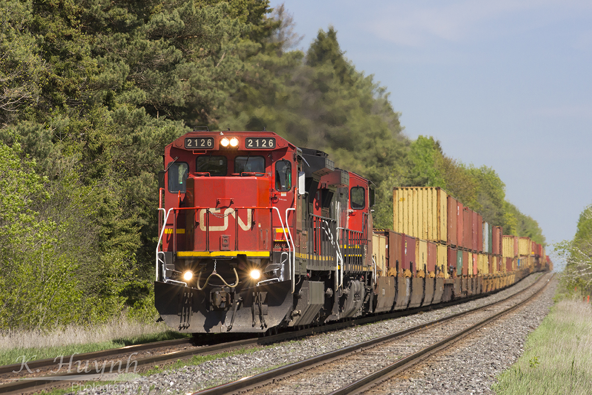 Dash 8 leading intermodal train westbound on the CN Kingston Sub.
